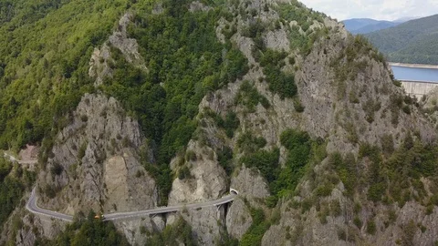 Drone Shot of Road Going Into Mountain Tunnel Video stock 101216919