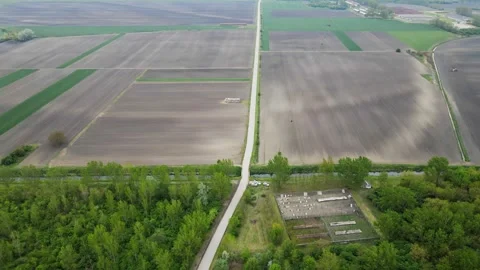 Drone shot of a road going through fields in countryside in Serbia Stock Footage 256414708