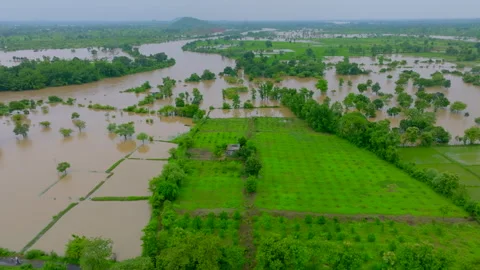 Drone shot The road got blocked due to rising river water in india Stock Footage 283263442