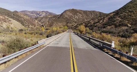 Drone shot of a road in the mountains Stock Footage 85157302
