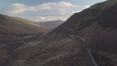 Drone shot of roads through the Scottish Valley Stock Footage 114884759