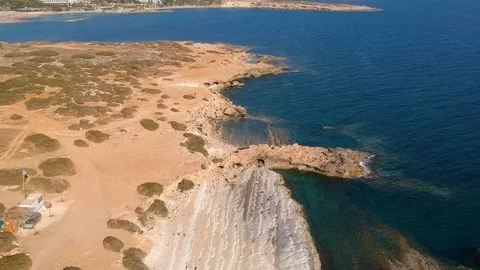 Drone shot of rock formations and coral reefs above beach Stock Footage 87936653