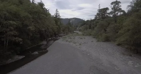 Drone Shot of Rocky stream running through the woods | Dolly In Stock Footage 137611498