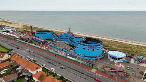 Drone shot of roller coaster in Great Yarmouth town, Norfolk, United Kingdom Stock Footage 337647677