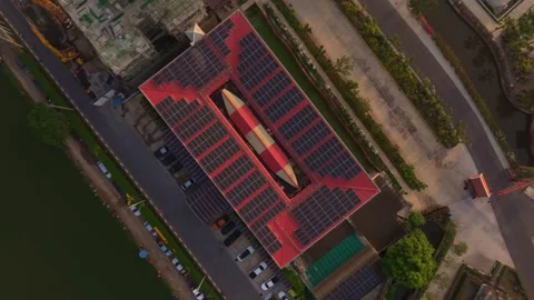 Drone shot of rooftop solar panels reflecting golden sunrise, Bangkok, Thailand Stock Footage 304374092