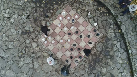 Drone shot rotating around giant chessboard in Bosnia, pastime Europe Видео 85829207