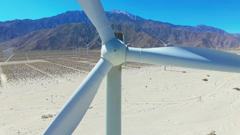 Drone shot of rotating wind turbine blades in Palm Springs desert  Stock Footage 334641469