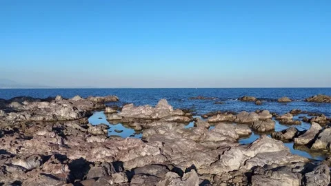 Drone Shot of Rugged Coastline and Calm Blue Sea Japan Stock Footage 329058107