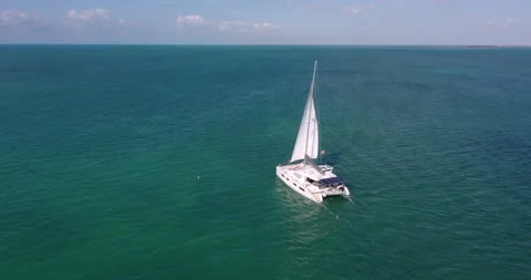 Drone Shot of sailboat exploring tropical Caribbean ocean Exclusive Island Vidéo 146474938