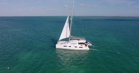 Drone Shot of sailboat exploring tropical Caribbean ocean Exclusive Island 스톡 동영상 146474943
