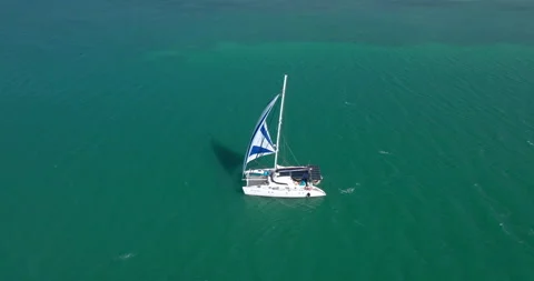 Drone Shot of sailboat exploring tropical Caribbean ocean Exclusive Island Vidéo 146474994