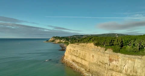 Drone shot of sandstone cliffs and countryside at Pett Level Stock Footage 343411197
