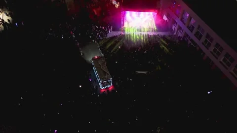 Drone shot of a Santa coming through with stage lights in Ukmerge during night Stock-Footage 324945834