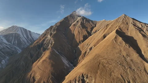 Drone shot of a serpentine mountain road in the Caucasus Mountains, Georgia. Видео 322964572