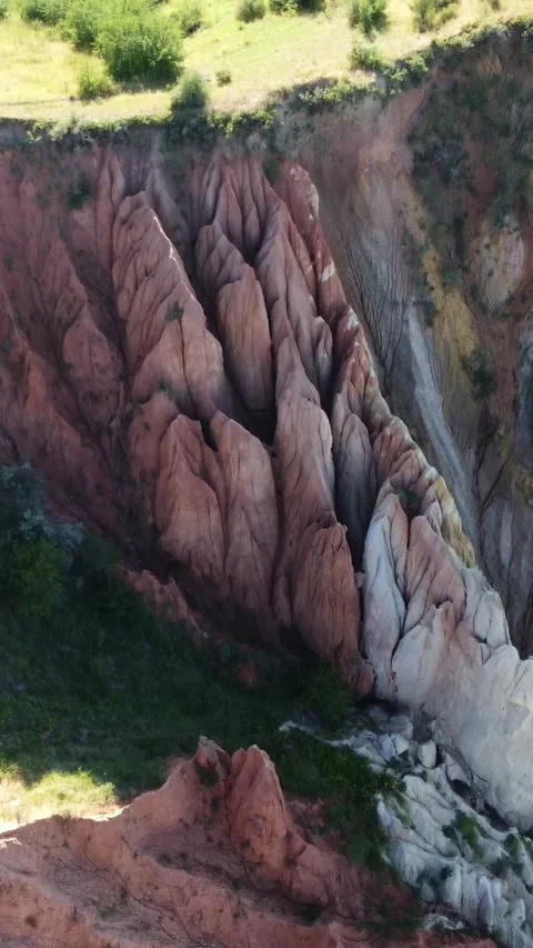 Drone shot of sharp limestone spires and dramatic clay ravines in Kazakhstan Stock Footage 338129435