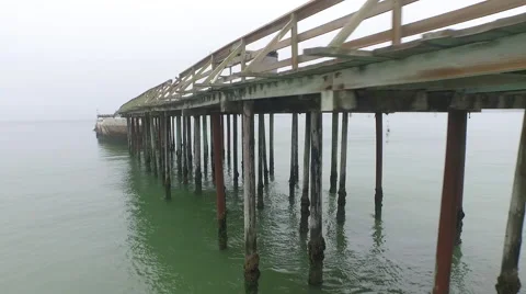Drone shot of a Ship Wreck-Beach-Pier-ocean Stock Footage 54568629