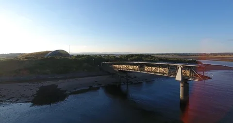 Drone Shot of Short Moveable Bridge off an Island in Scotland at Sunset Stock Footage 97526970