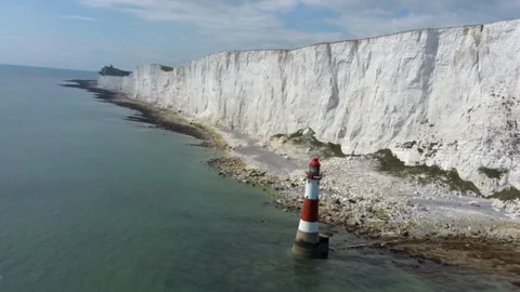 Drone Shot Showing Beachy Head Lighthouse and White Chalk Cliffs Along Coast in Stock Footage 342296468