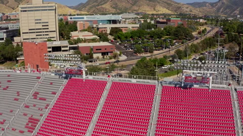 Drone shot showing the Rice-Eccles Stadium and the surrounding landscape Stock Footage 341247992