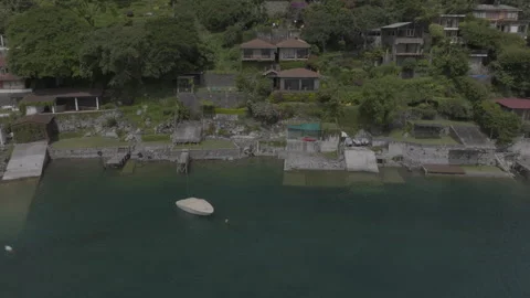 Drone shot showing three building lake house during the summer from a drone.. Video stock 277534862