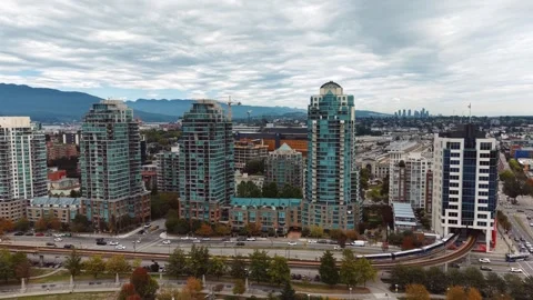 Drone Shot of SkyTrain Train Crossing Vancouver's West End Stock-Footage 345983960