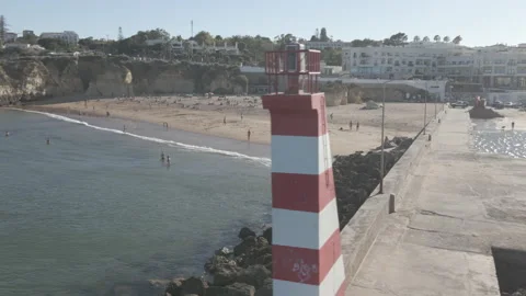 Drone shot of small beachfront along port in Lagos, Portugal.  Stock Footage 224962285