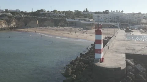 Drone shot of small beachfront along port in Lagos, Portugal.  Stock Footage 224964963