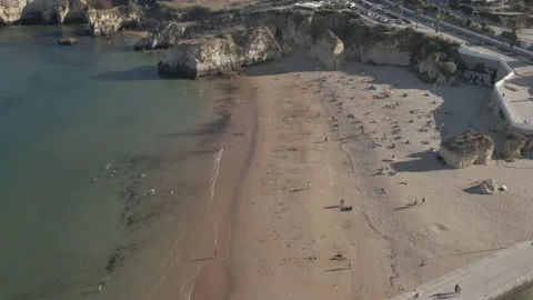 Drone shot of small beachfront along port in Lagos, Portugal.  Stock Footage 224967951