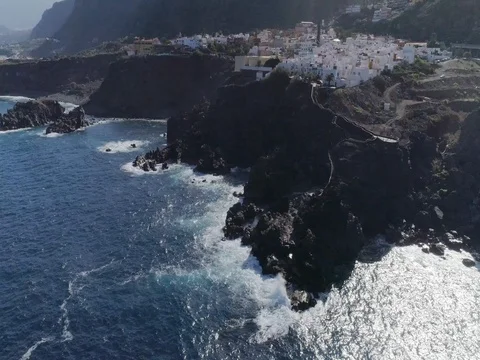 Drone shot of small city located over shoreline in sunny weather. Canary Islands Stock Footage 83869970