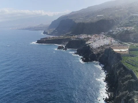 Drone shot of small city located over shoreline in sunny weather. Canary Islands Stock Footage 83870083