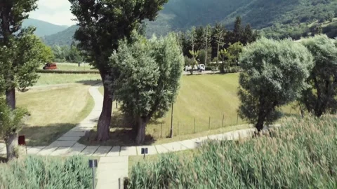 Drone shot from a small lake dock with boats to a mountain view, Italy Stock Footage 276224390