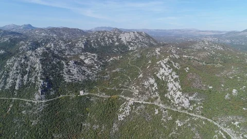 Drone shot of small mountain road with sharp corners in Montenegro Stock Footage 85818883