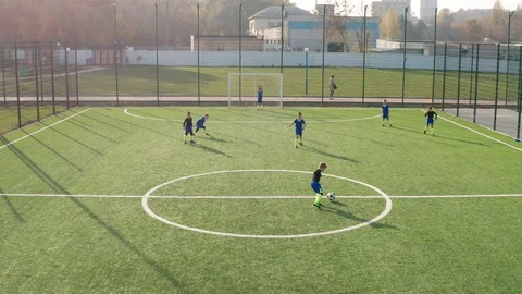 Drone shot of soccer forward trying to score goal Stock Footage 123033749