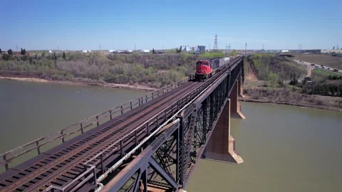 Drone Shot of a special Train crossing a Bridge in Edmonton, Alberta, Canada Stock Footage 308388690