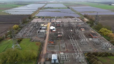 Drone shot of sprawling electricity grid infrastructure and photovoltaic solar Stock Footage 340268298