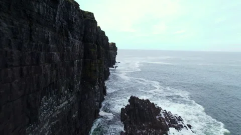 Drone Shot of Steep Cliffs Above Atlantic Ocean on Coastline of Ireland, Loop Stock Footage 344171462
