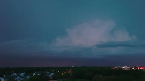 Drone shot of Stormy clouds forming on gloomy sky before heavy rainfall and Stock Footage 248240913