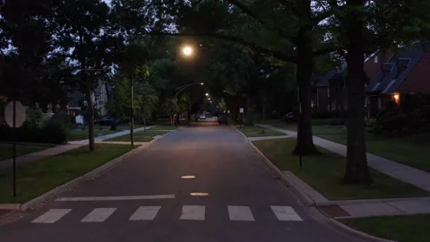 Drone shot of a street in the US in a typical suburban neighborhood - Stock Footage 159138089