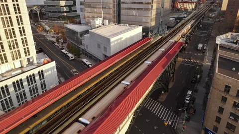 Drone shot of a subway train leaving the station in Harlem Stock Footage 256750420