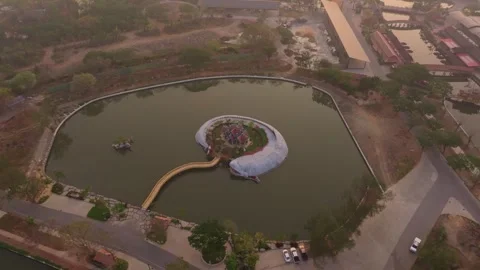 Drone shot of Sumeru Mountain temple glowing at sunrise, Bangkok Stock Footage 304373876