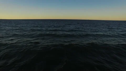 A drone shot of a sun set on a beach of Lake Superior in Northern Michigan Stock Footage 136199401