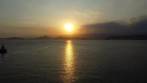 Drone Shot Sun Setting Behind The Sea Video stock 229973953