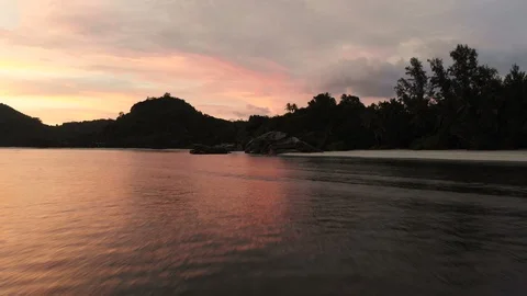 Drone shot of sundown at perfect beach on Seychelles Stock Footage 87034660