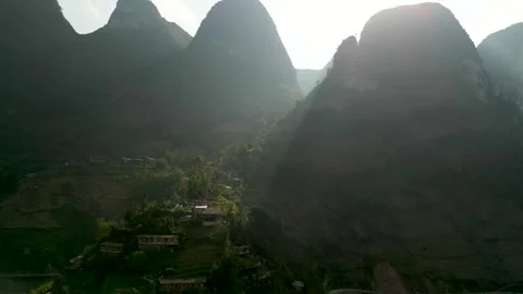Drone Shot with Sunrays over a Mountain home – Ha Giang, Vietnam Video stock 313798363