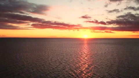 Drone Shot Of Sunset And Calm Sea, 6K Vídeos de archivo 333038536