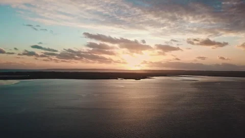 Drone shot of Sunset and Storm Lakes Entrance Stock Footage 294622951