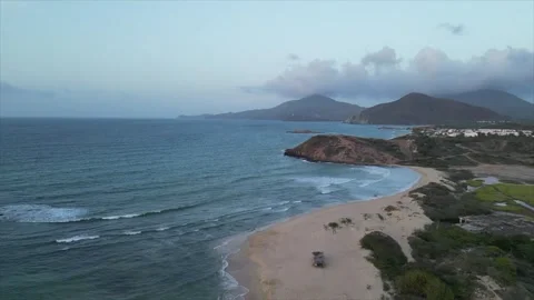 Drone shot of a sunset on the beach, Isla Margarita, Venezuela Stock Footage 261020744