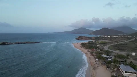 Drone shot of a sunset on the beach, Isla Margarita, Venezuela Stock Footage 261020834