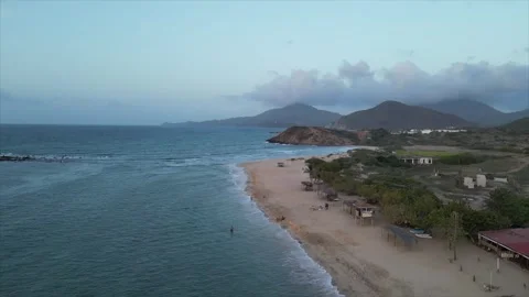 Drone shot of a sunset on the beach, Isla Margarita, Venezuela Stock Footage 261020845