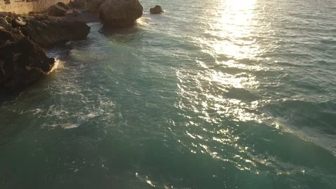 Drone Shot in Sunset with Bech and Ocean and waves Stock Footage 233598802
